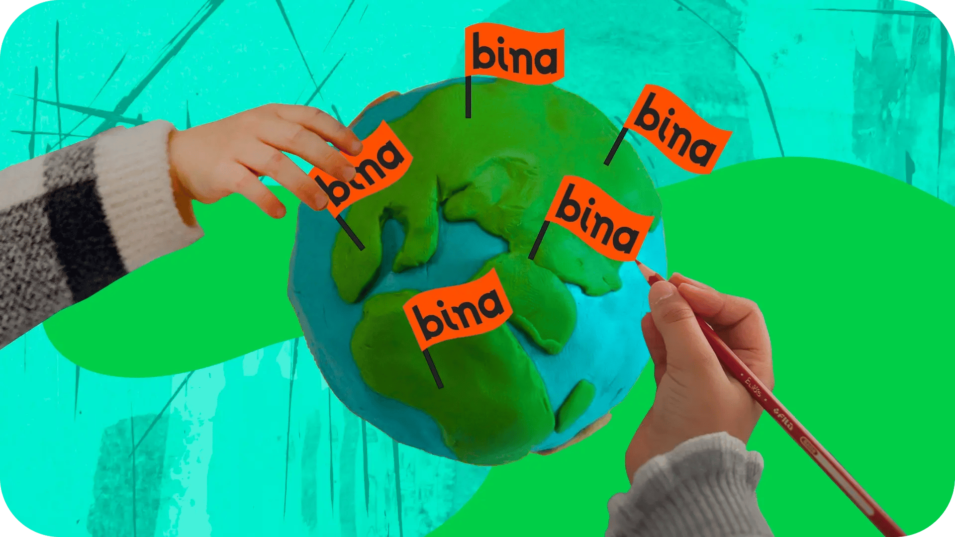 two children hands pining little bina flags on a globe