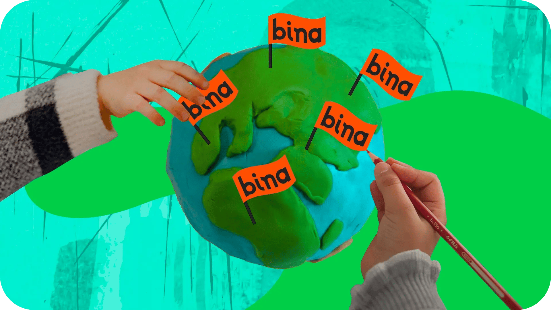 two children hands pining little bina flags on a globe